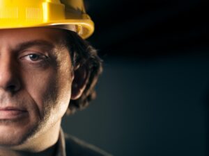 Portrait Of Adult Manual Worker With Helmet